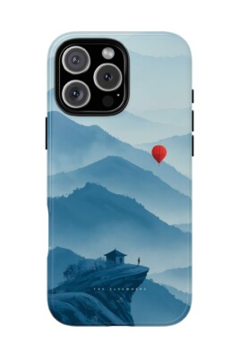 Minimal phone case with red balloon floating above blue mountains